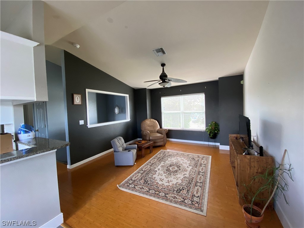 17146 Oriole Road Fort Myers, FL 33967 - Photo 19 of 38 a living room with furniture and a flat screen tv