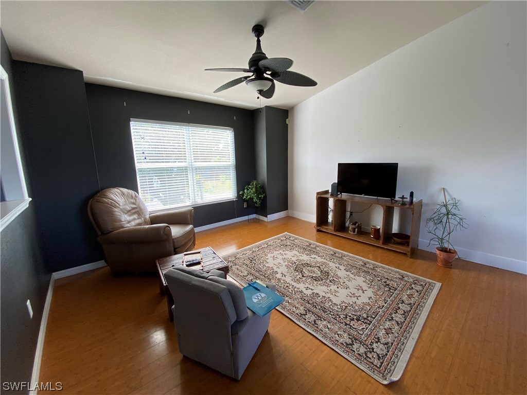 17146 Oriole Road Fort Myers, FL 33967 - Photo 20 of 38 a living room with furniture and a flat screen tv