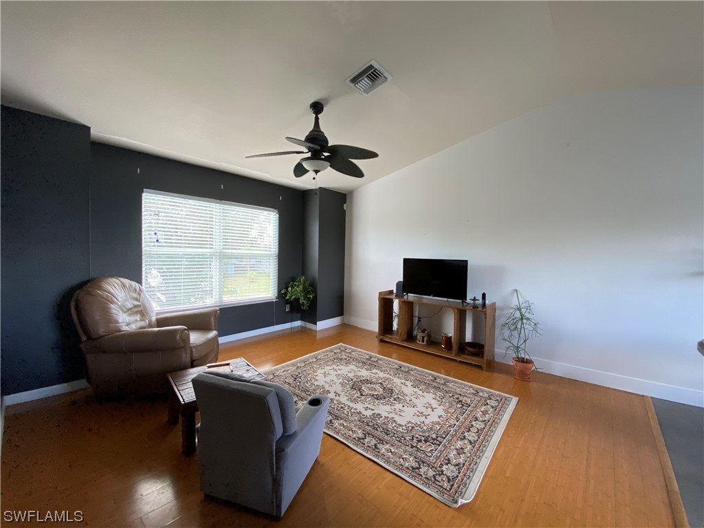 17146 Oriole Road Fort Myers, FL 33967 - Photo 21 of 38 a living room with furniture and a flat screen tv