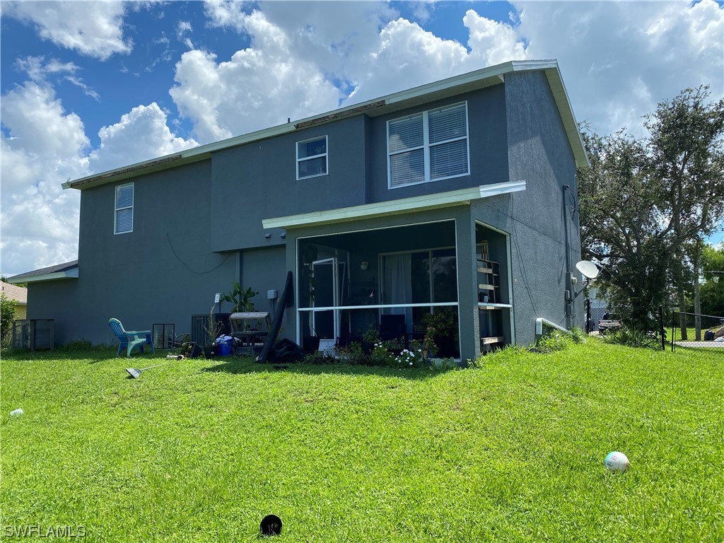 17146 Oriole Road Fort Myers, FL 33967 - Photo 36 of 38 a view of a house with a yard and sitting area