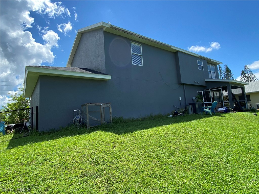 17146 Oriole Road Fort Myers, FL 33967 - Photo 37 of 38 a backyard of a house with seating space