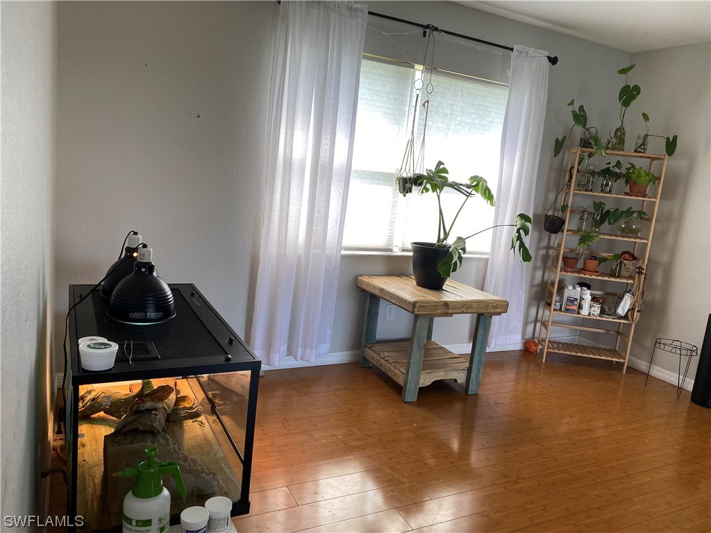 17146 Oriole Road Fort Myers, FL 33967 - Photo 4 of 38 a room with furniture and a window