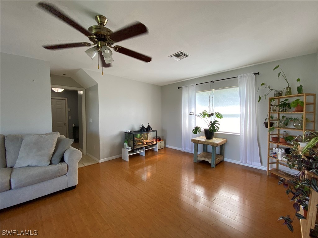 17146 Oriole Road Fort Myers, FL 33967 - Photo 5 of 38 a living room with furniture and a wooden floor