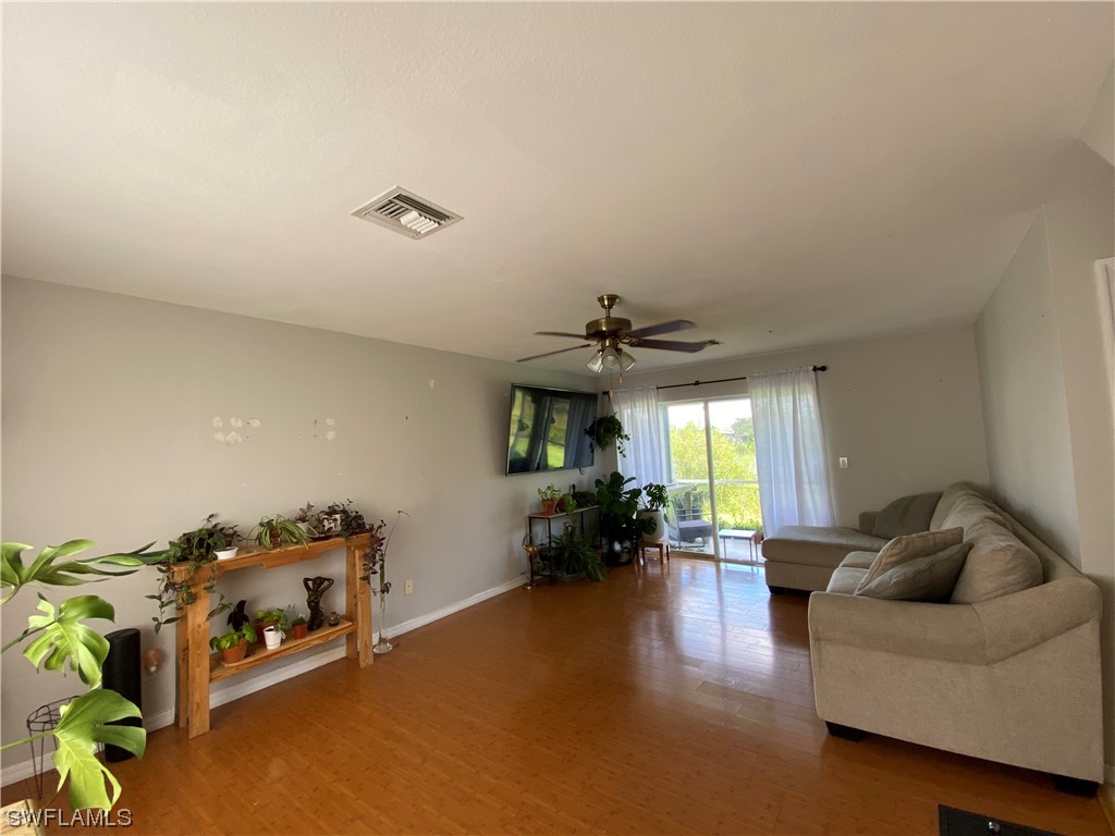 17146 Oriole Road Fort Myers, FL 33967 - Photo 8 of 38 a living room with furniture and a flat screen tv