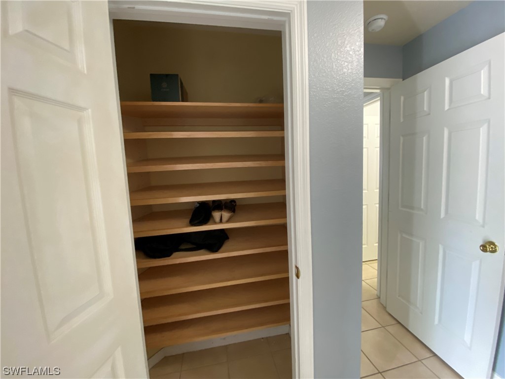 17146 Oriole Road Fort Myers, FL 33967 - Photo 9 of 38 a view of walk in closet with empty racks