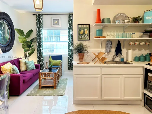 a living room with furniture and a lamp