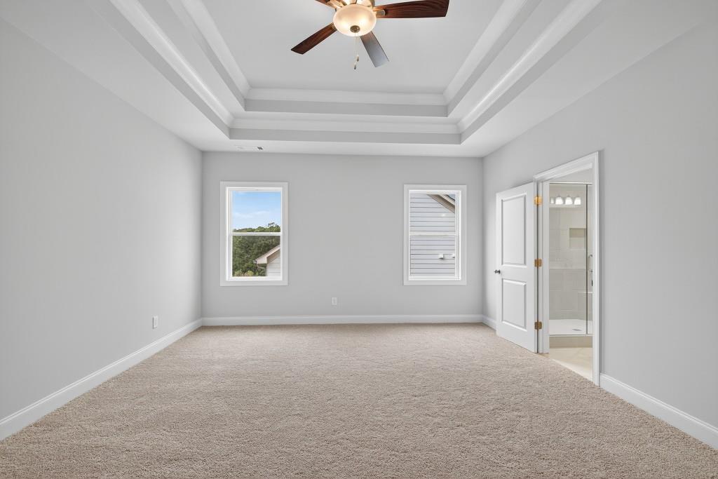 5579 Spring Street Flowery Branch, GA 30542 - Photo 24 of 65 an empty room with a ceiling fan and window