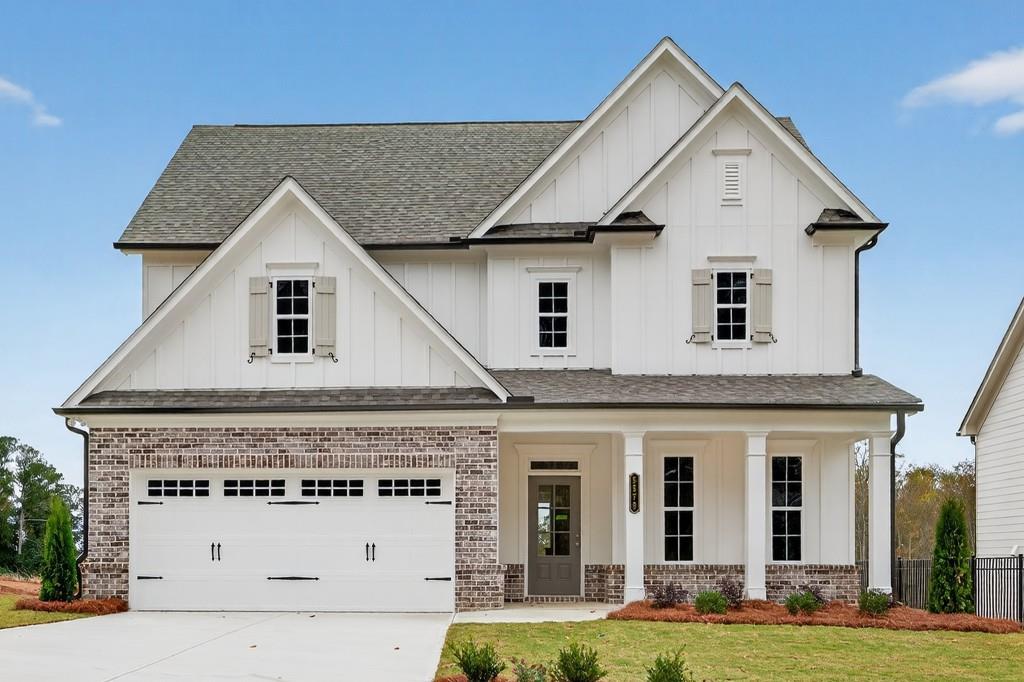 5579 Spring Street Flowery Branch, GA 30542 - Photo 3 of 65 a view of a white house with yard