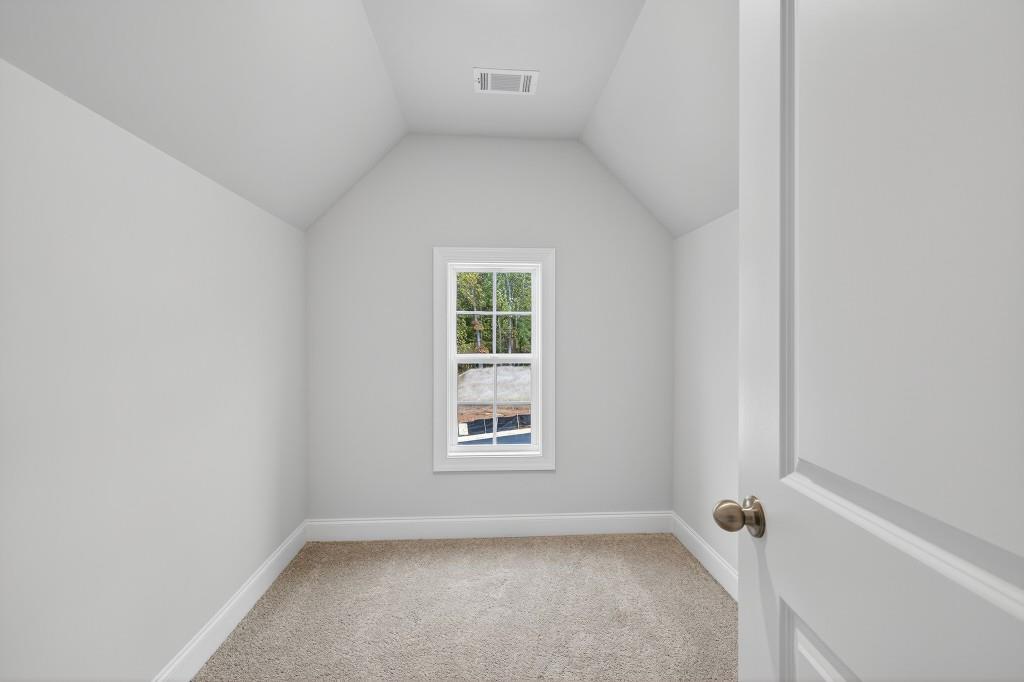 5579 Spring Street Flowery Branch, GA 30542 - Photo 34 of 65 a view of an empty room with a window