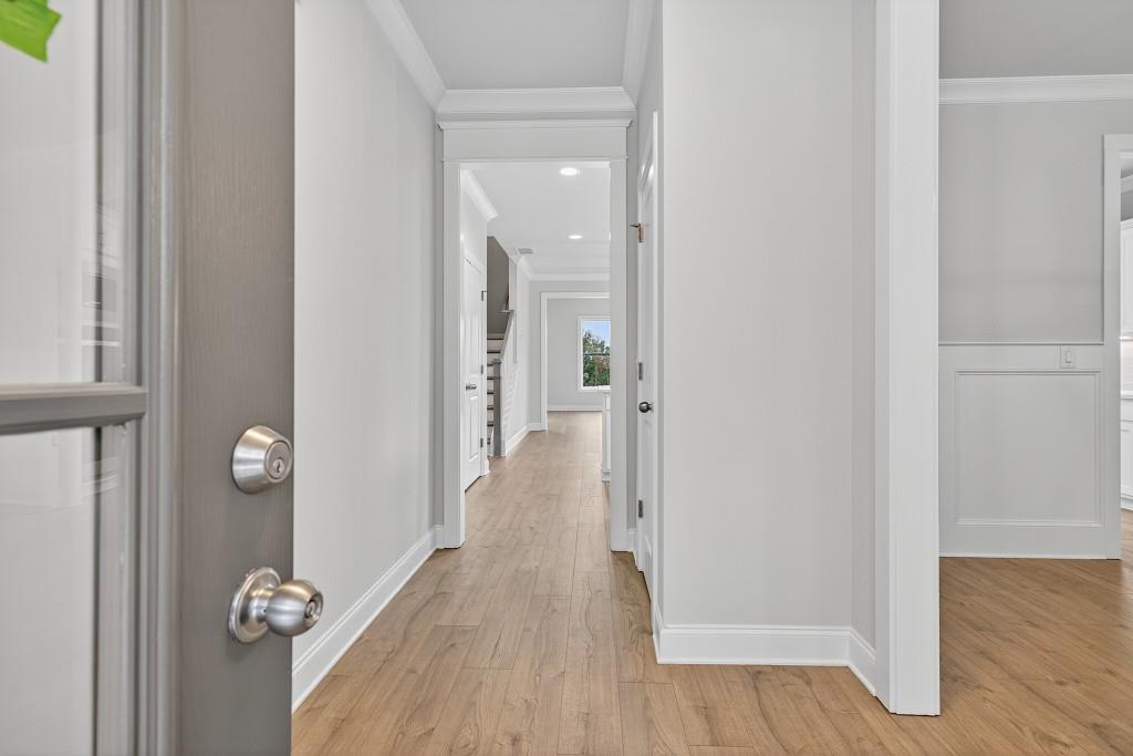 5579 Spring Street Flowery Branch, GA 30542 - Photo 4 of 65 a view of a hallway with wooden floor and closet