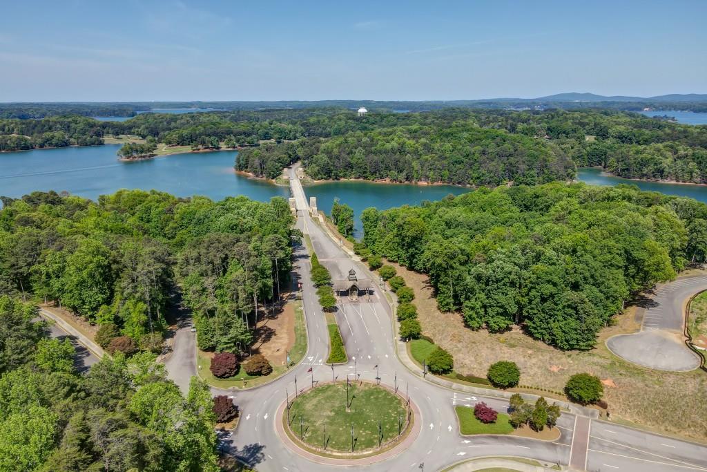 5579 Spring Street Flowery Branch, GA 30542 - Photo 46 of 65 a aerial view of a house with a yard and lake view