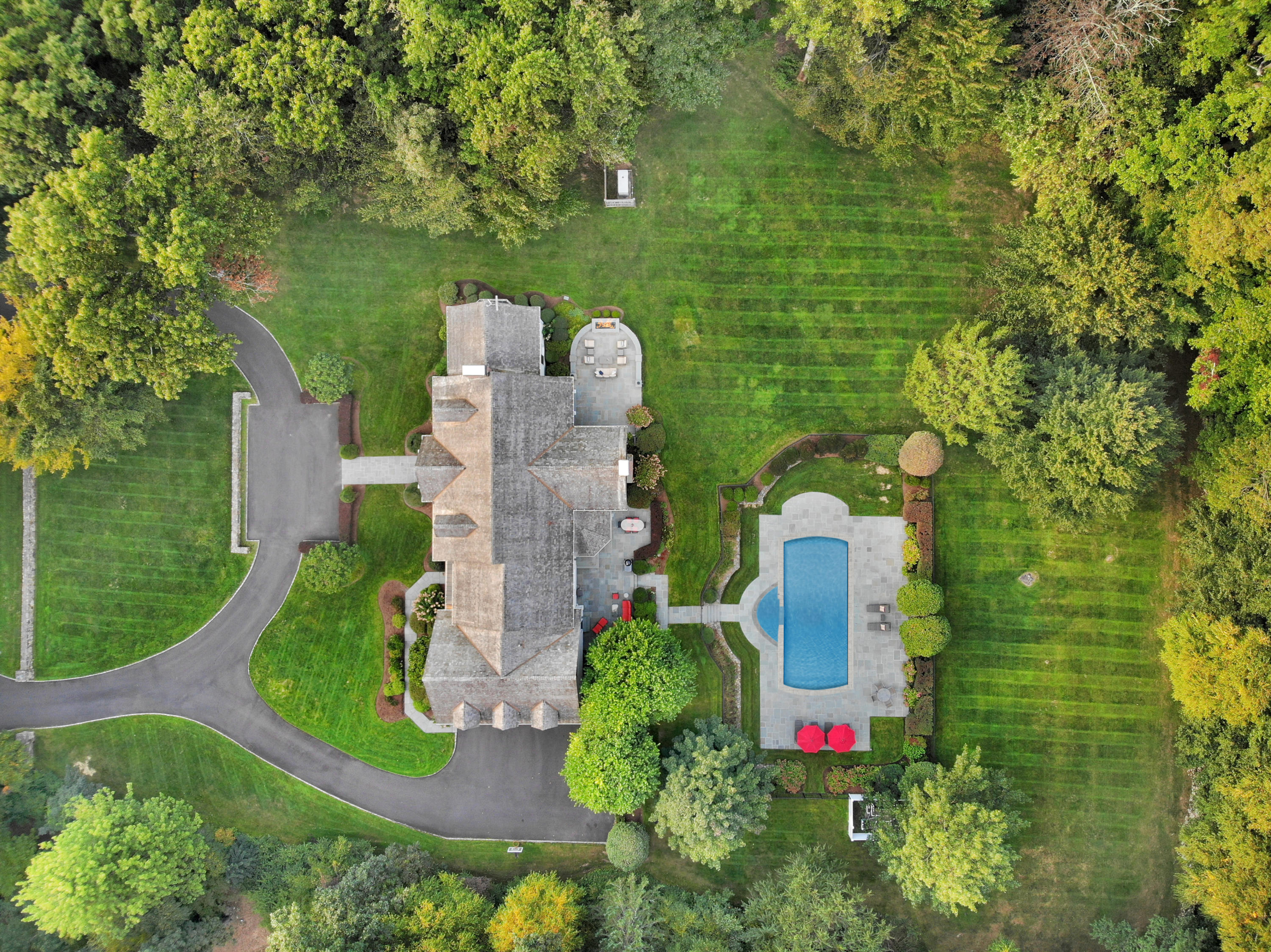 31 Ramhorne Road New Canaan, CT 06840 - Photo 50 of 56 an aerial view of a house with outdoor space and street view
