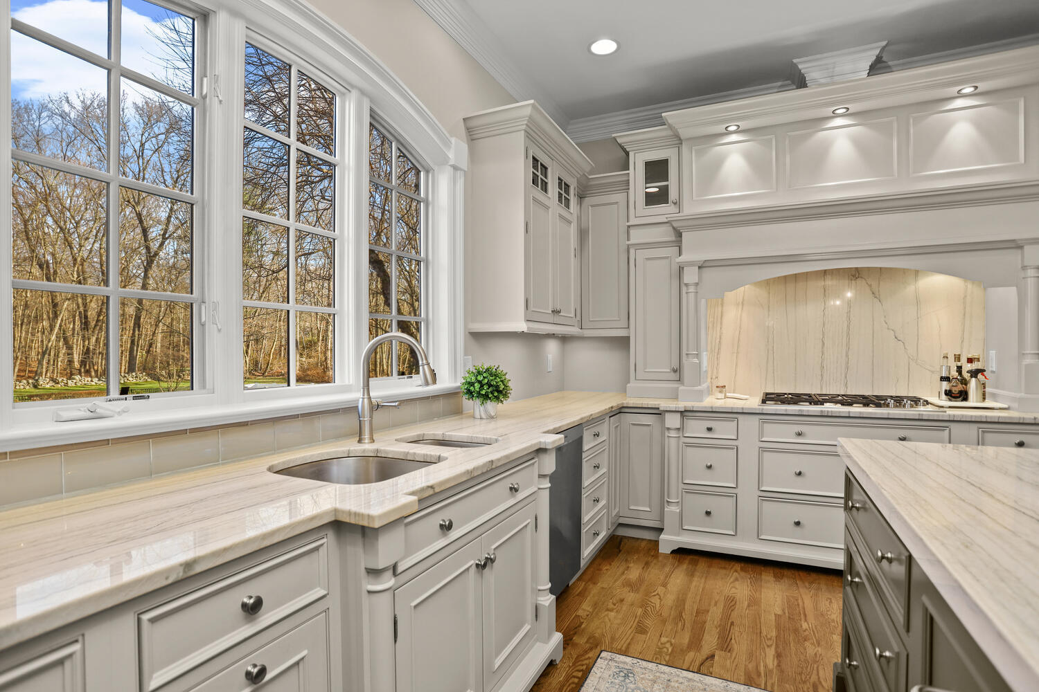31 Ramhorne Road New Canaan, CT 06840 - Photo 8 of 56 a kitchen with a sink stove and cabinets