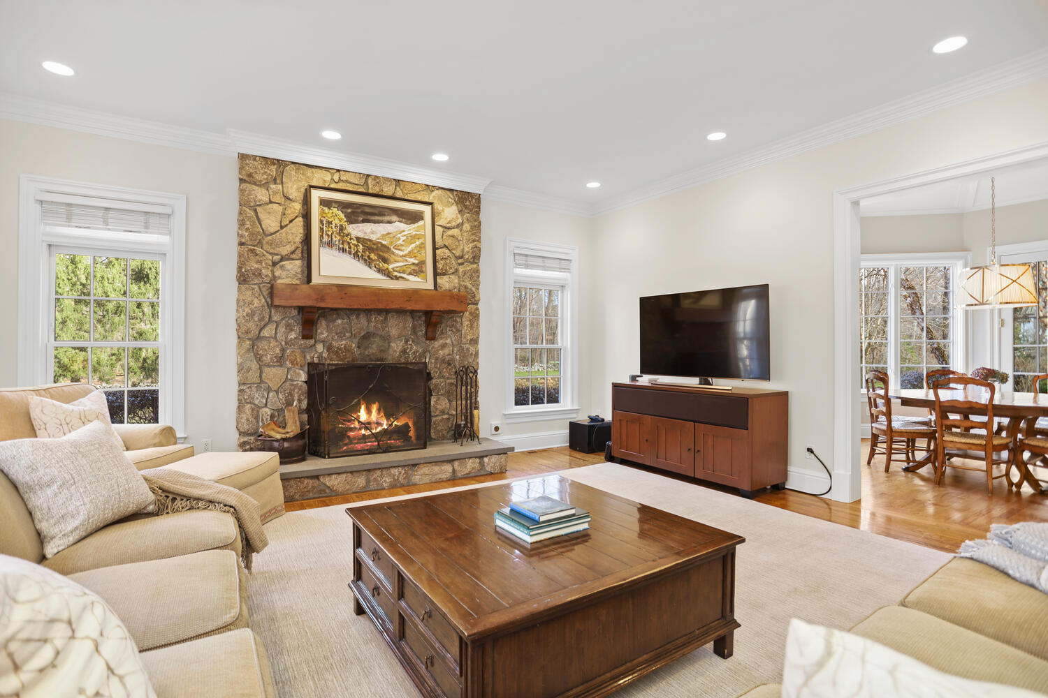 31 Ramhorne Road New Canaan, CT 06840 - Photo 10 of 56 a living room with furniture a flat screen tv and a fireplace