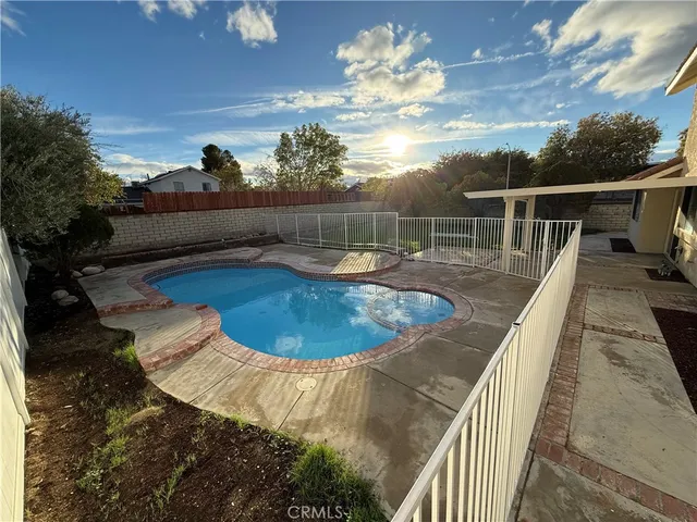 a view of a swimming pool with a patio