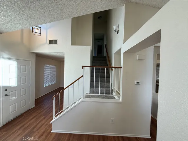 a view of entryway with wooden floor
