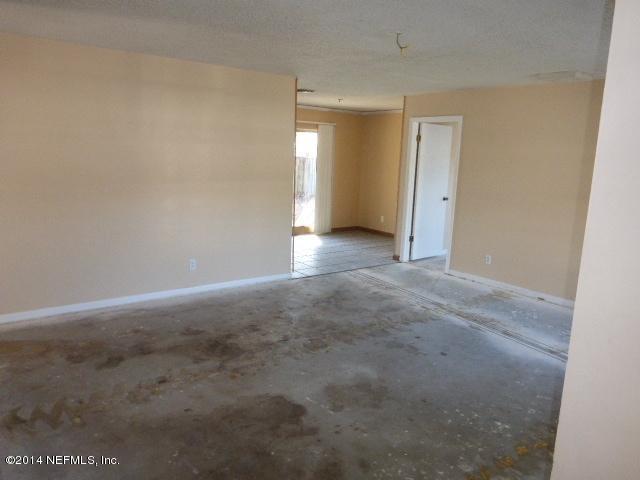 8362 Kipling Court Jacksonville, FL 32244 - Photo 14 of 16 LR FROM FOYER MISSING FIXTURE EXPOSED WI