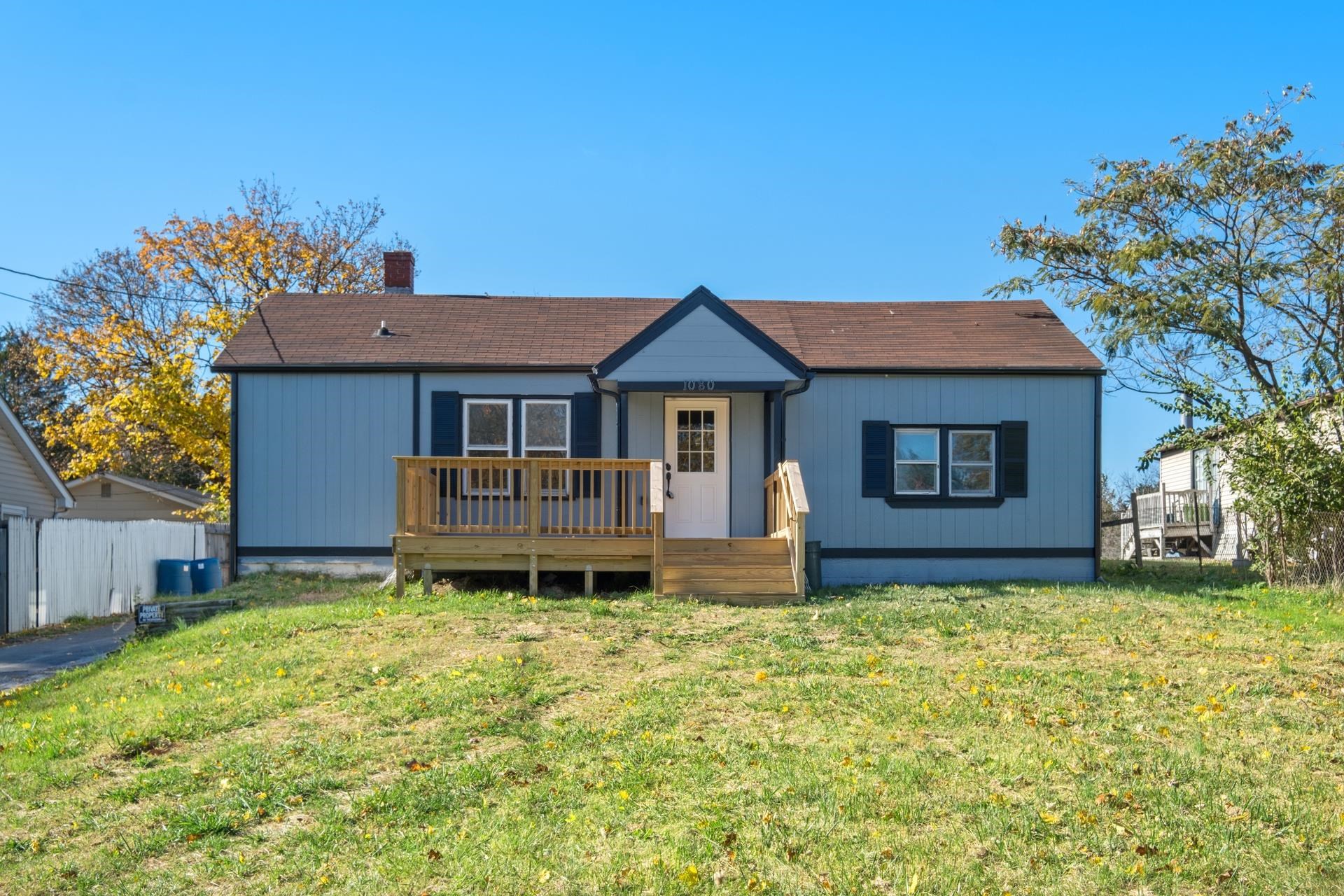 a front view of a house with a garden and porch