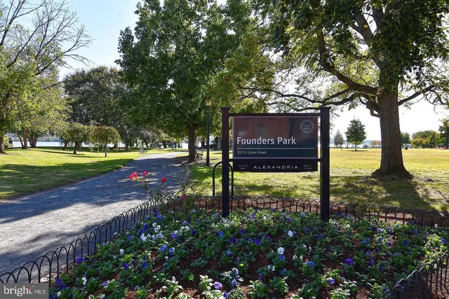 a view of a street with benches in the background
