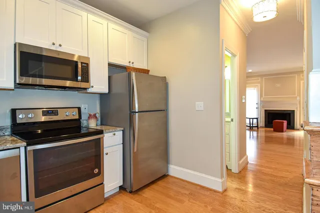 a kitchen with a stove and a microwave