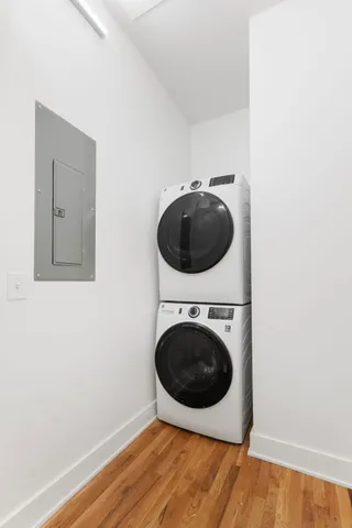 a view of a hallway with washer and dryer