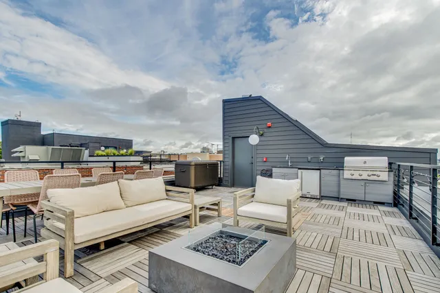a view of a balcony with wooden floor