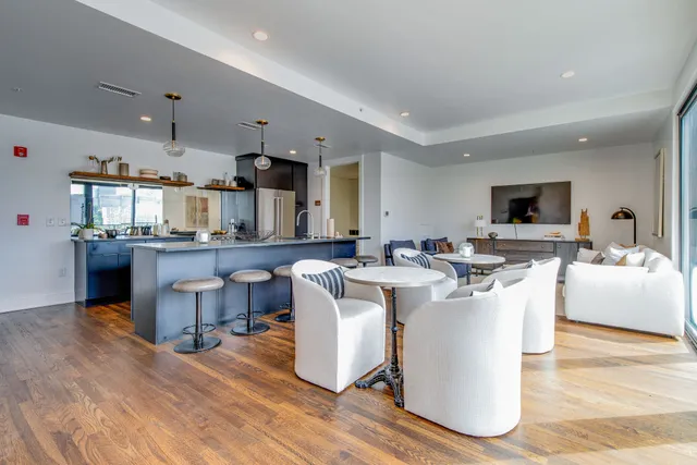 a view of a kitchen with a refrigerator and an oven