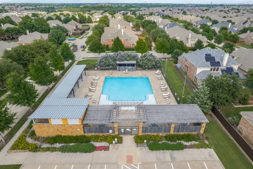 14215 Raspberry Lane Frisco, TX 75035 - Photo 27 of 30 Community swimming pool featuring a perimeter fence and lounge seating