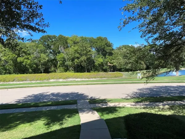a view of a swimming pool with a yard
