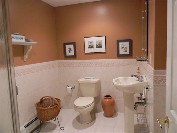 90 Lilah Lane Reading, MA 01867 - Photo 10 of 18 a bathroom with a toilet a sink and mirror