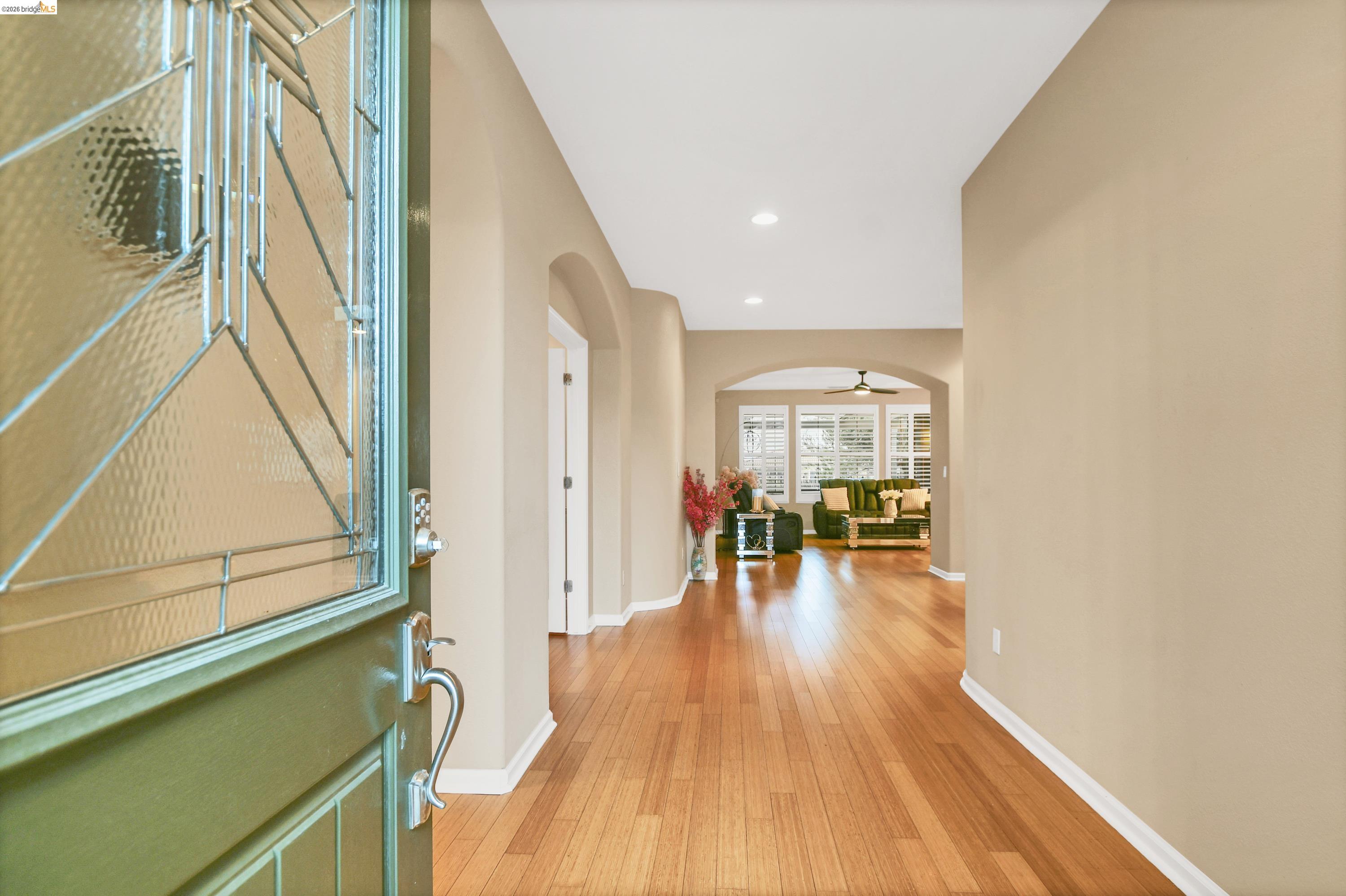 342 Desert Forest Court Rio Vista, CA 94571 - Photo 17 of 40 Foyer entrance featuring arched walkways, light wood-style flooring, recessed lighting, and a ceiling fan