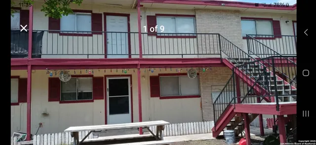a view of front door of house with stairs