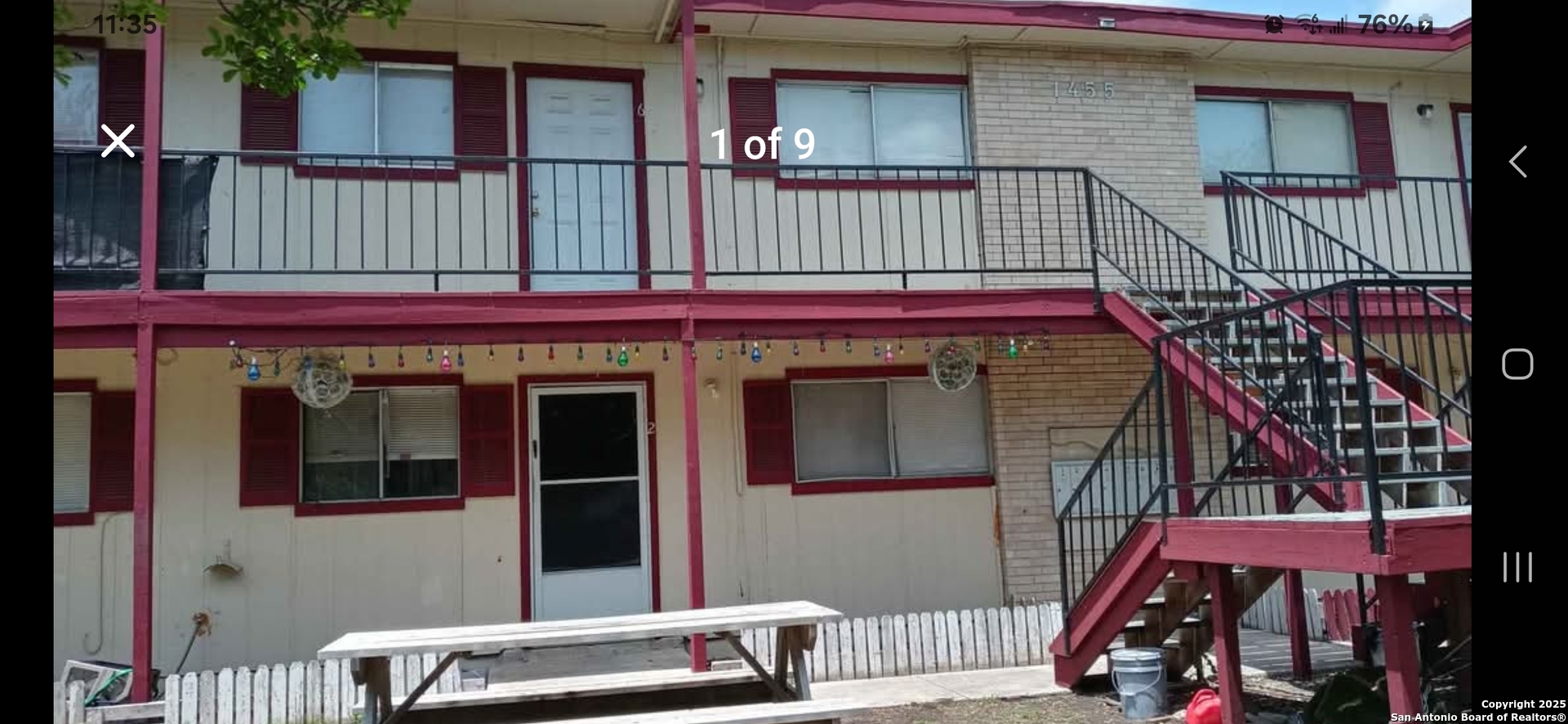 a view of front door of house with stairs
