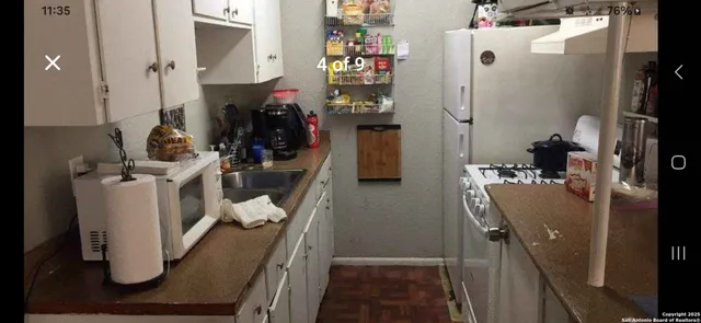 a living room with furniture and wall painting