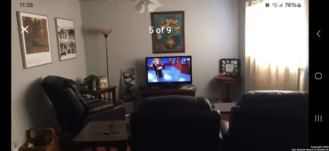 a bathroom with a sink vanity mirror and toilet