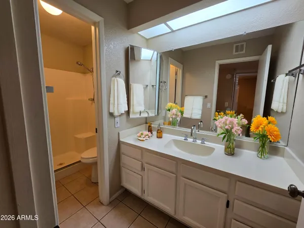 a bathroom with a sink double vanity and a mirror