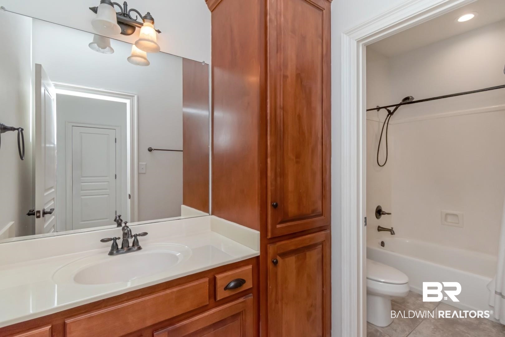 30585 Pine Court Daphne, AL 36527 - Photo 42 of 49 Bathroom featuring vanity, bathing tub / shower combination, and light tile patterned flooring