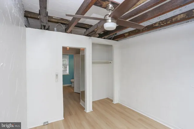 a view of room with window and hardwood floor