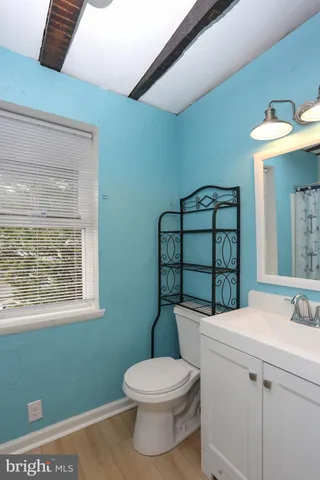 a bathroom with a shower and a sink