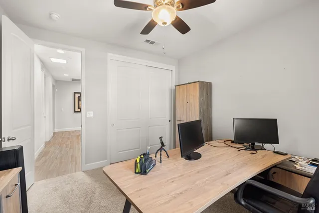 a view of a backyard with plants and patio