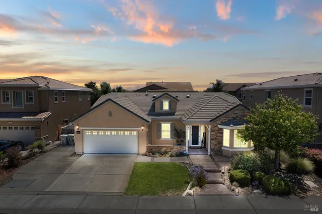 an aerial view of residential houses with city view