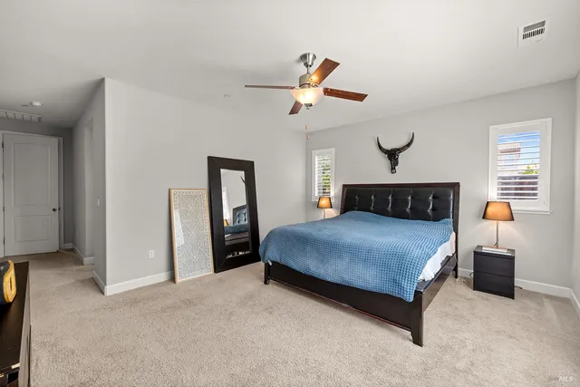 a view of a patio with table and chairs and wooden floor