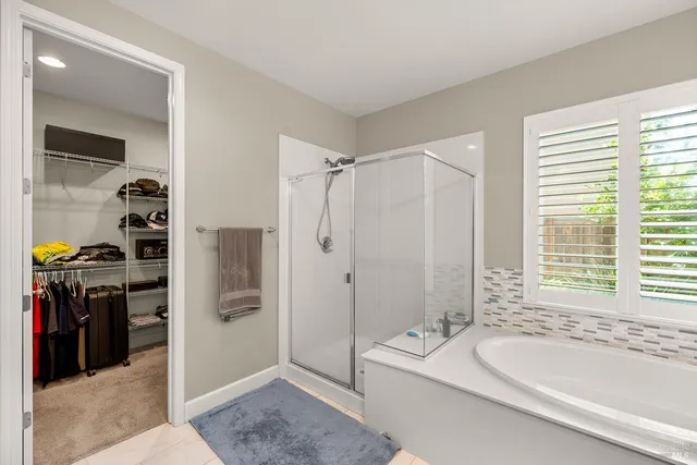 a view of a house with a swimming pool and a yard