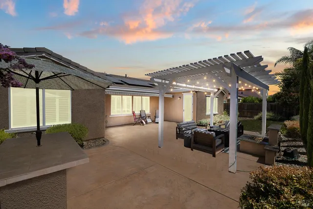 a view of a livingroom with a ceiling fan and window
