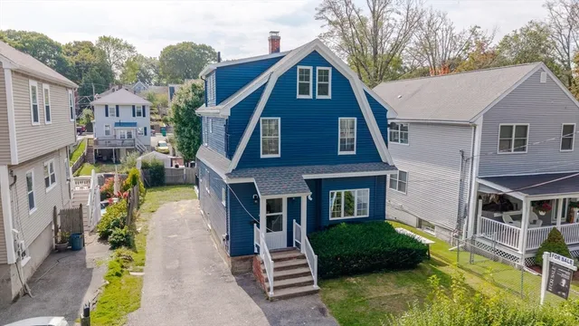 a aerial view of a house with a yard
