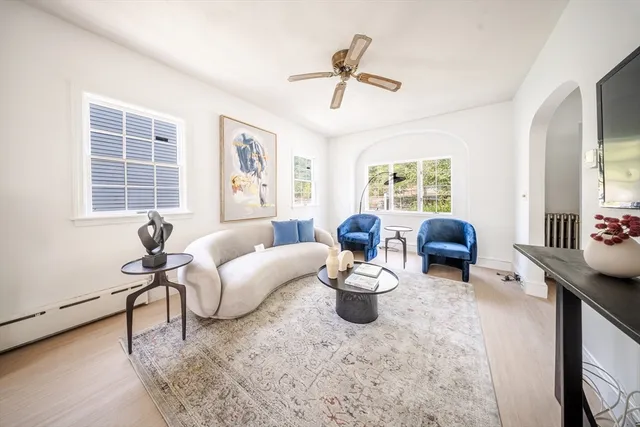 a living room with furniture and a window