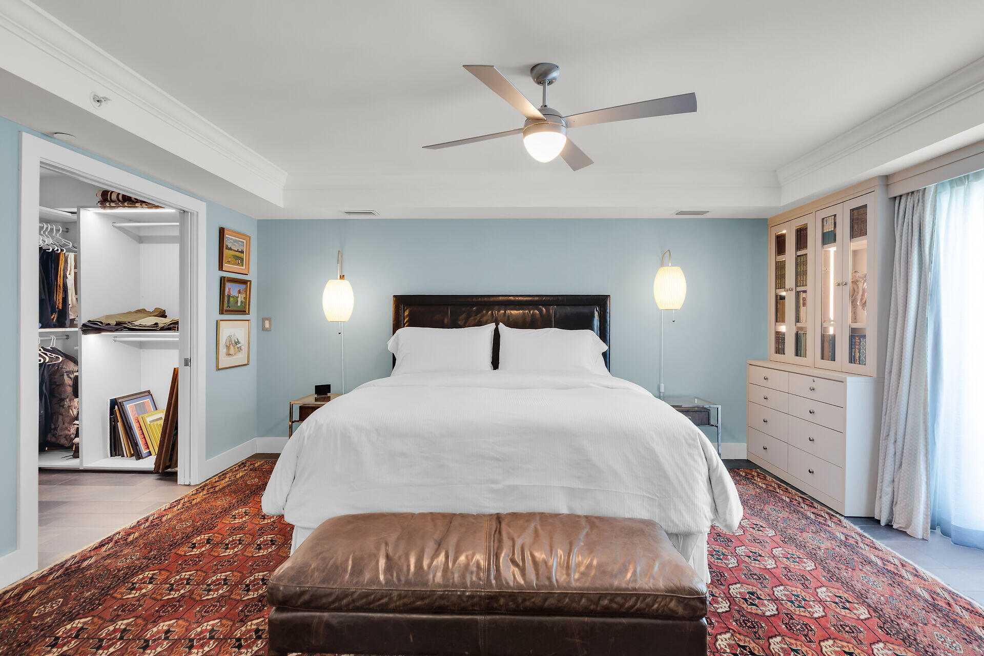 141 Simonton Street Key West, FL 33040 - Photo 25 of 49 a bedroom with a large bed and a chandelier