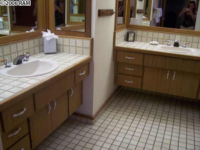 100 Ridge Road, Unit 1721 Lahaina, HI 96761 - Photo 14 of 17 a bathroom with a sink vanity and mirror