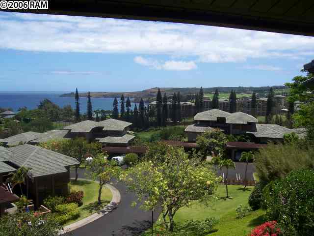100 Ridge Road, Unit 1721 Lahaina, HI 96761 - Photo 3 of 17 a backyard of a house with table and chairs