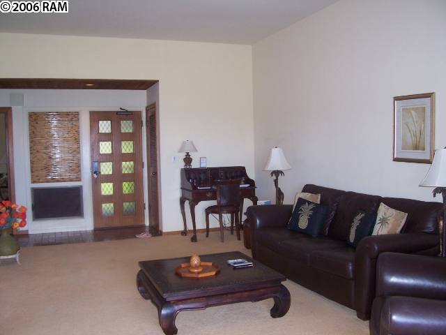 100 Ridge Road, Unit 1721 Lahaina, HI 96761 - Photo 8 of 17 a living room with furniture and wooden floor